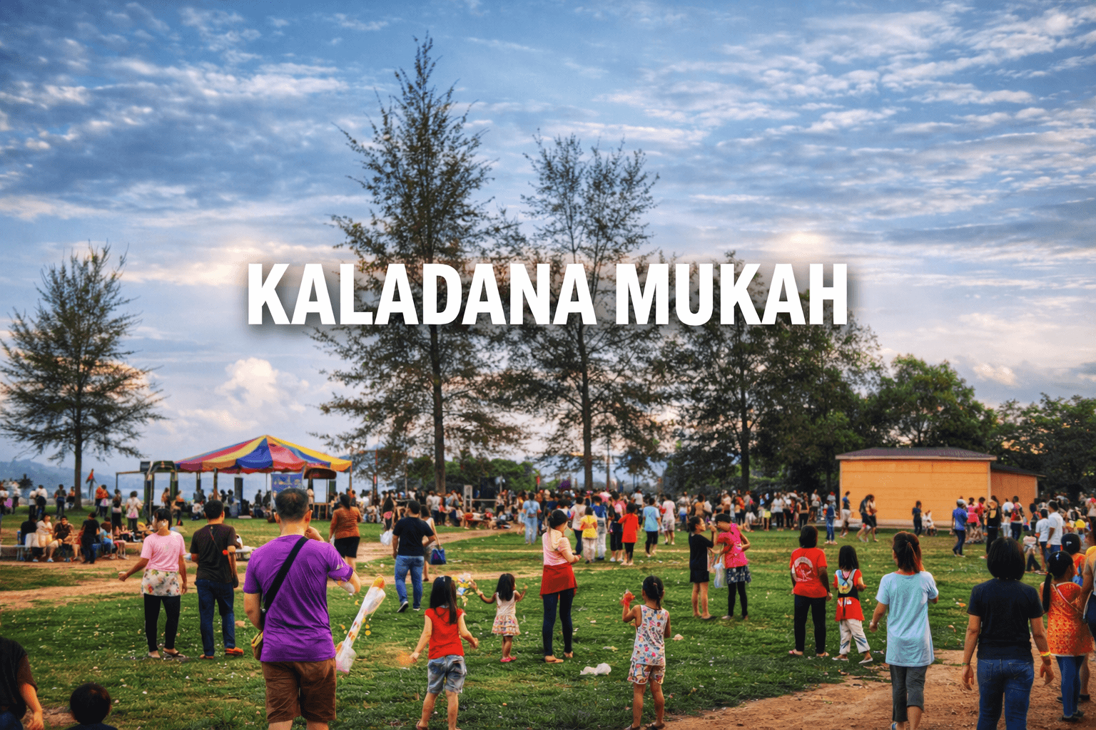 People gather in a grassy field at Kaladana Mukah with trees and a colorful tent.